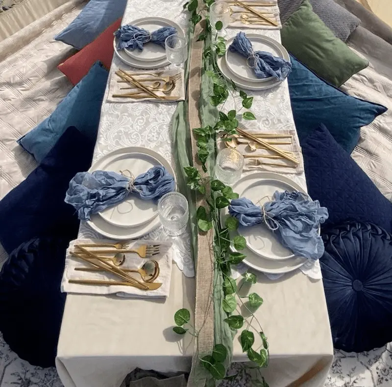 Luxury picnic tablescape in Newport Oregon with blue theme place settings