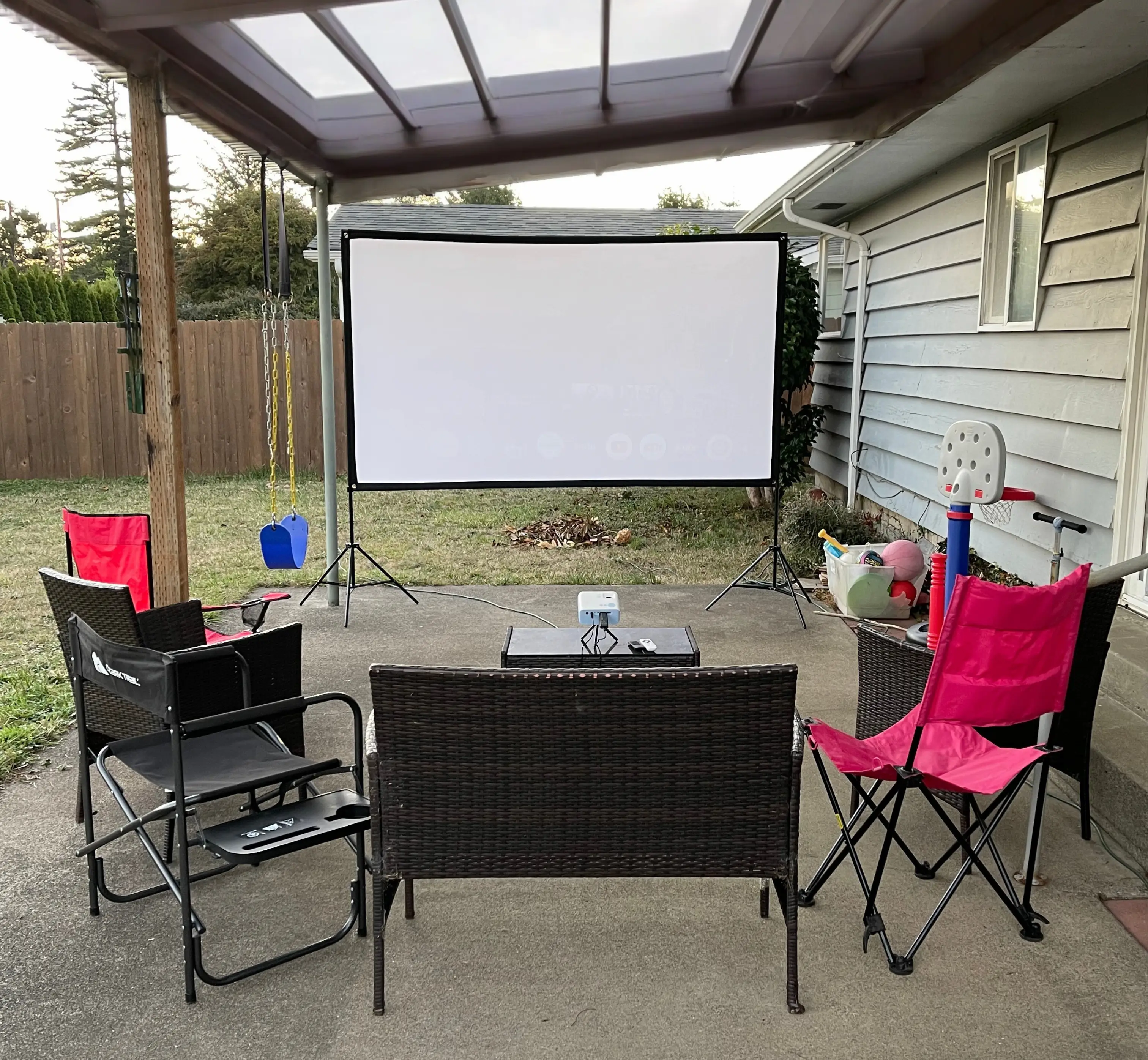 Outdoor movie night rental in Newport Oregon with screen seating and cozy setup
