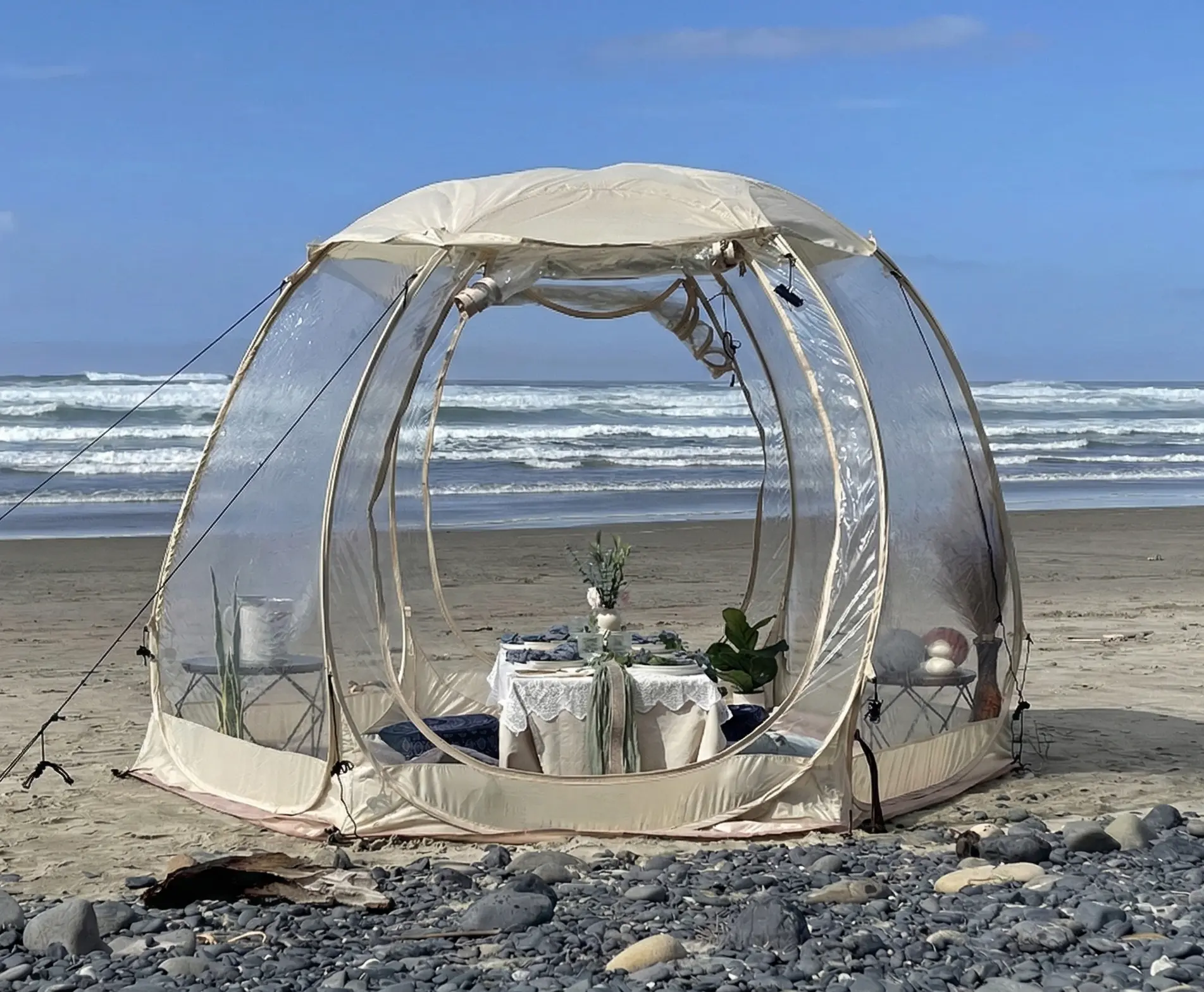 Wide view of clear bubble dining setup on the Oregon Coast near Newport Oregon