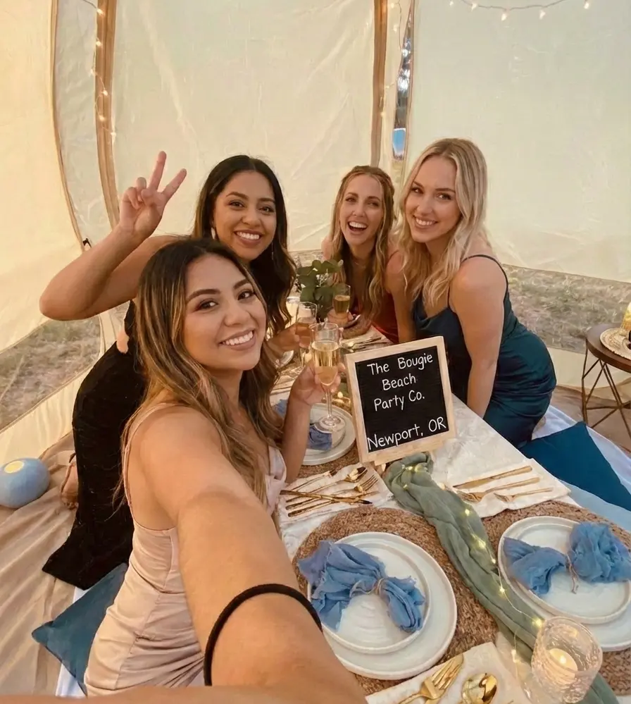 Guest taking selfies inside a clear party bubble rental near Newport Oregon