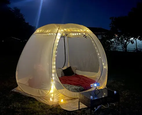 Clear bubble movie night setup in Newport Oregon backyard with projector and seating